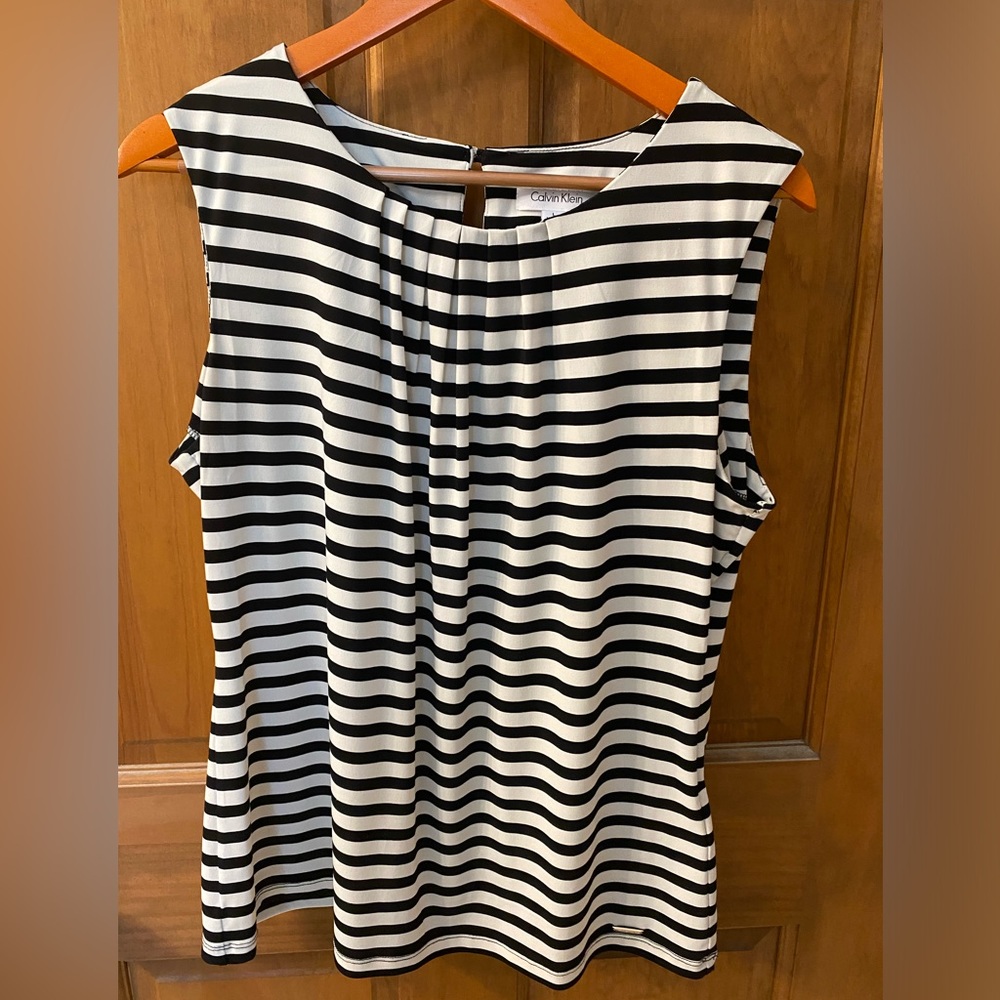 Calvin Klein women’s black and white striped sleeveless top.